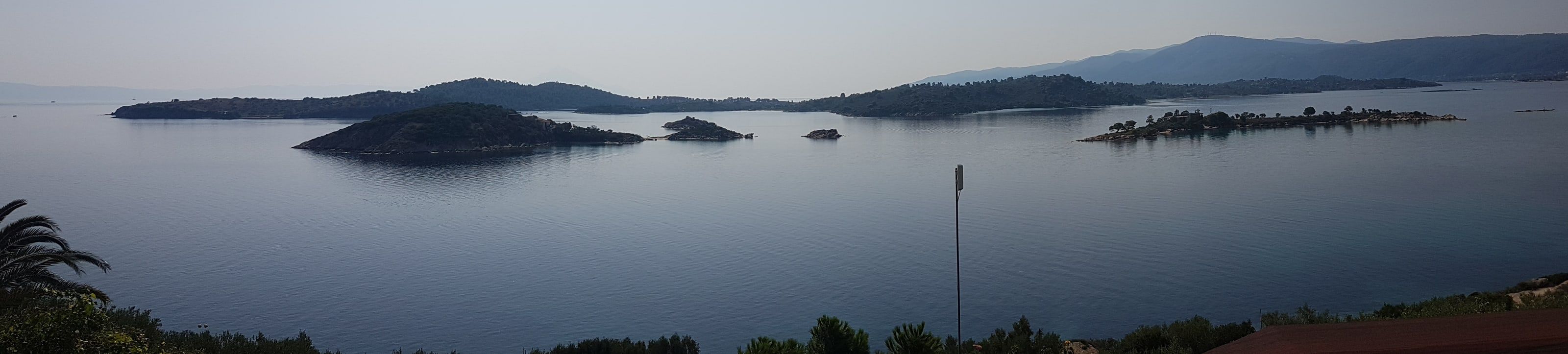 Diaporos and small wooded islands in the calm bay off Vourvourou