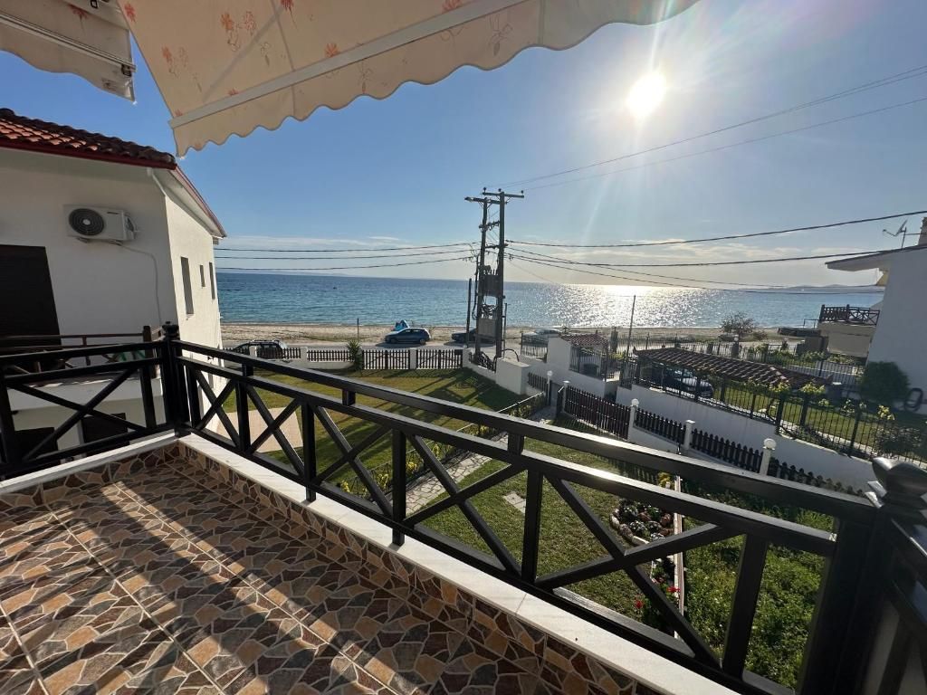 Upper balcony at Villa Anastassia overlooking the garden, beach and Aegean Sea