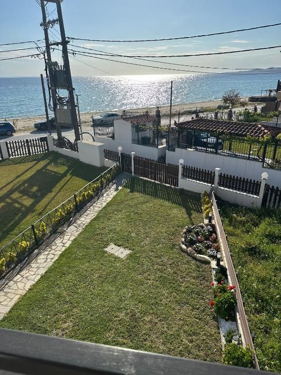 Garden path at Villa Anastassia leading toward the beach and Aegean Sea in Nikiti