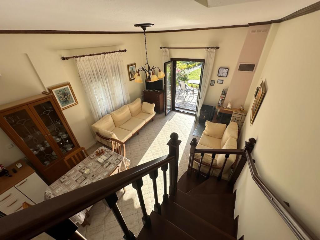 View from the staircase across the open living and dining room at Villa Anastassia